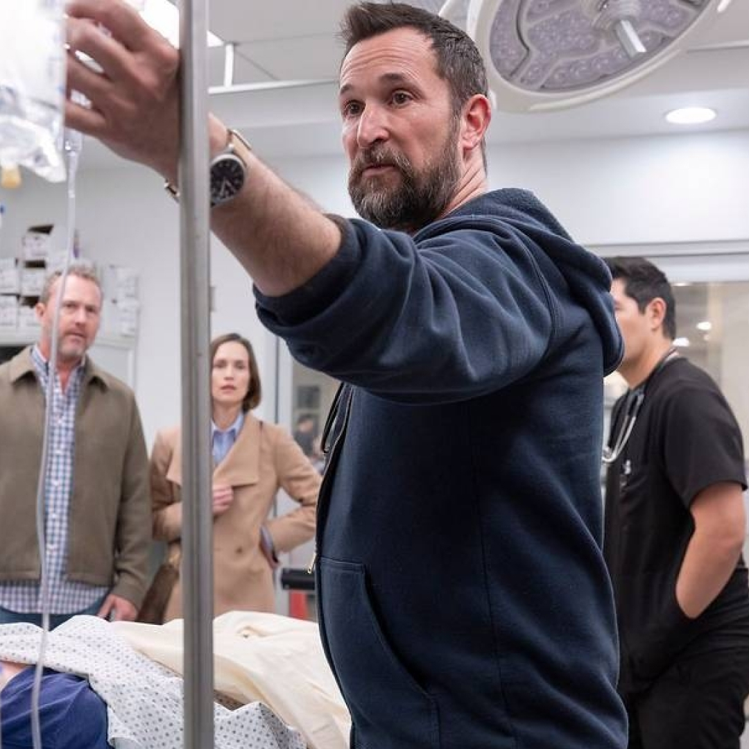 noah wyle as dr. robby checking a patient's vitals in a still from the pitt season 1 finale