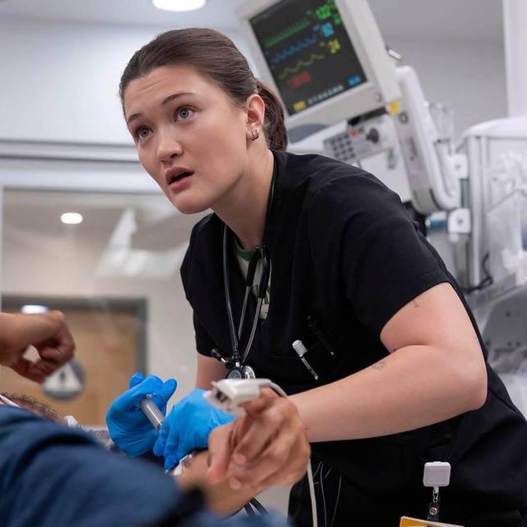 isa briones as dr. santos tending to a patient in the pitt